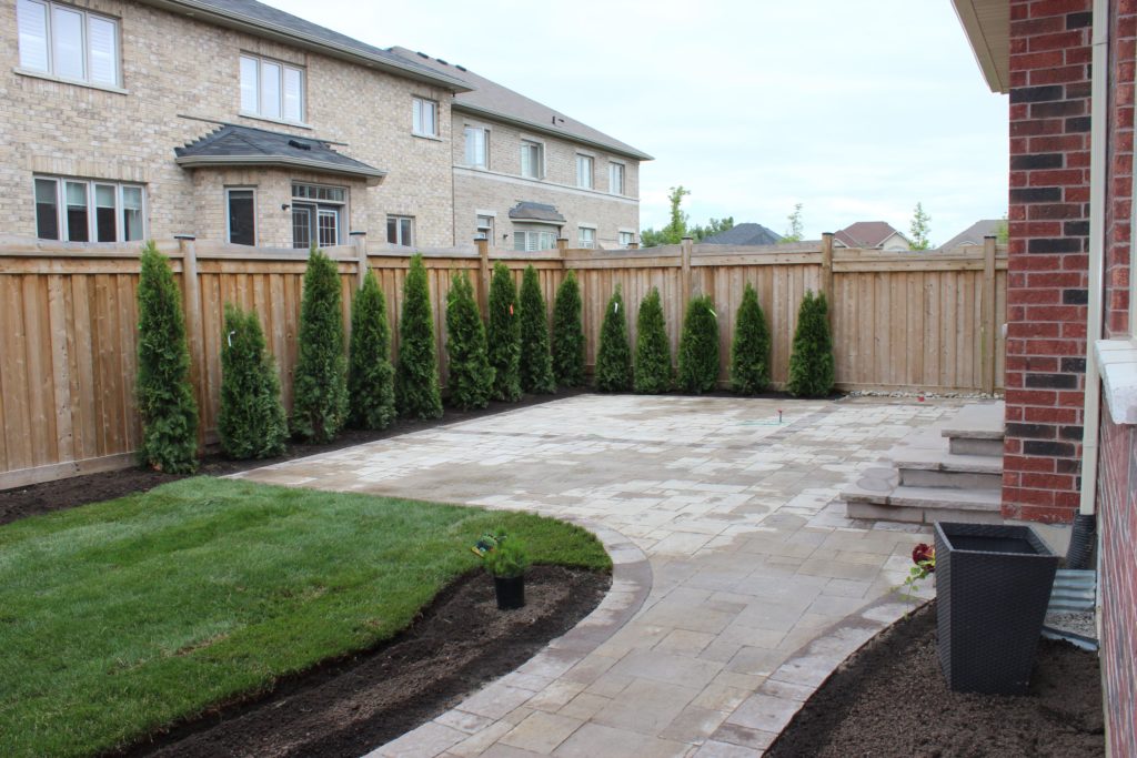 interlocking patio, sodding, flagstone steps, evergreens