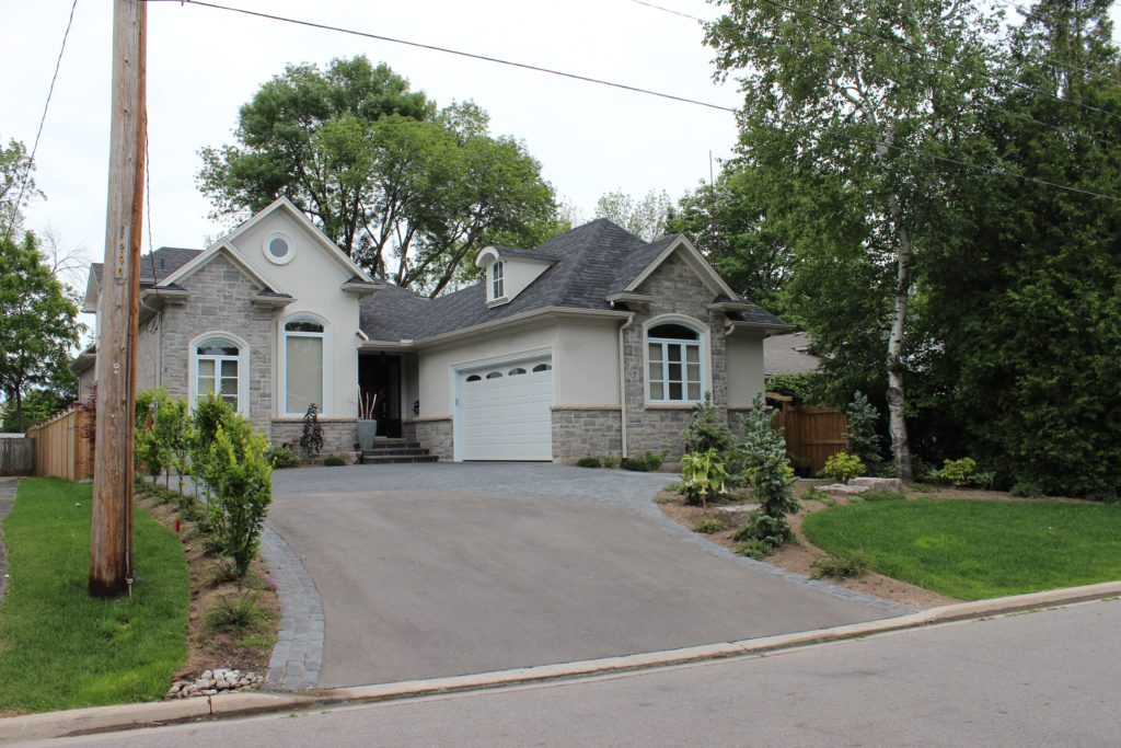 interlocking driveway, sodding, shrubs, hedges