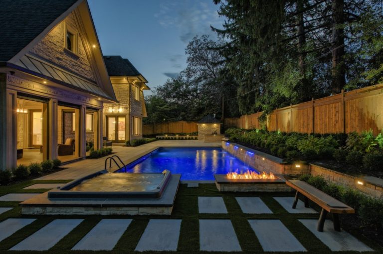 pool landscaping, luxury, outdoor firepalce, spa, retaining wall, waterfall, hedges, bushes, garden, outdoor lighting, patio